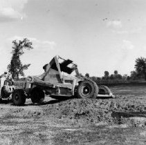 Washington School Principal Robert Reid Surveys the Excavating Being Done